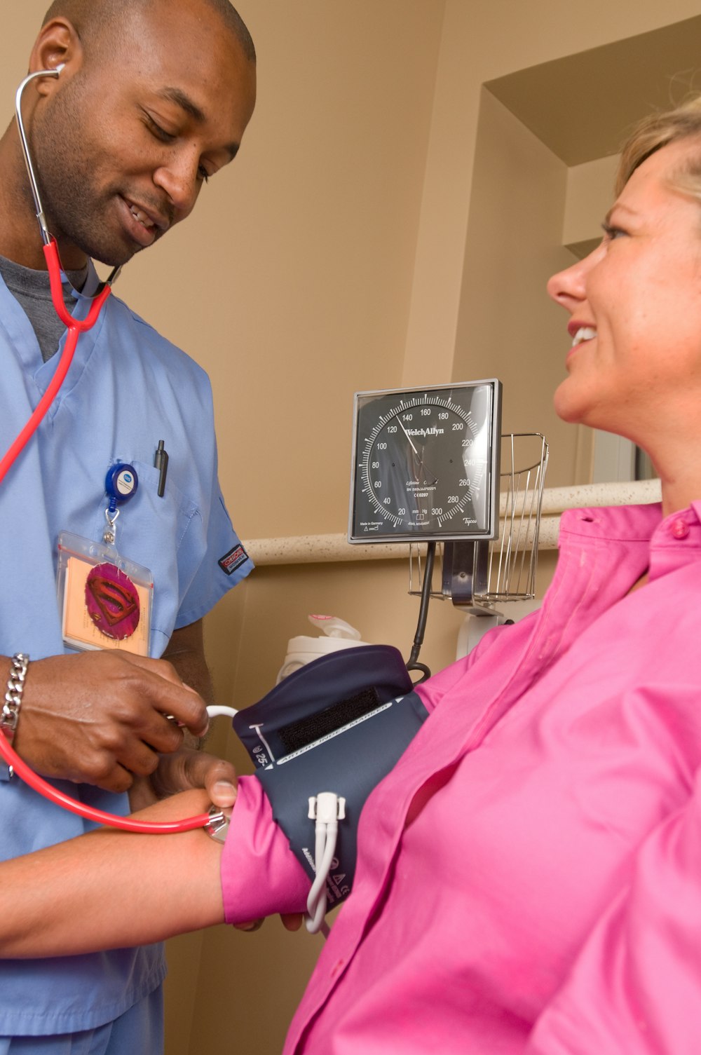 Pediatrician examining a young child during wellness visit